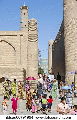 Colourfully dressed people in the historic centre of Chiwa, Uzbekistan, Central Asia, Asia View Large Photo Image Picture - Colourfully dressed people in the historic centre of Chiwa, Uzbekistan, Central Asia, Asia. Fotosearch