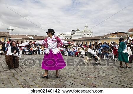 Stock Image - Costume dance groups on the Plaza San Francisco during a car-free Sunday in the historic town centre of Quito, Ecuador, South America. Fotosearch