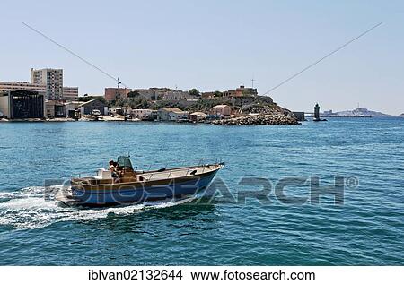 Couple cruising on a motorboat off Marseille, Provence-Alpes-Côte d'Azur, France, Europe View Large Photo Image Picture - Couple cruising on a motorboat off Marseille, Provence-Alpes-Côte d'Azur, France, Europe. Fotosearch