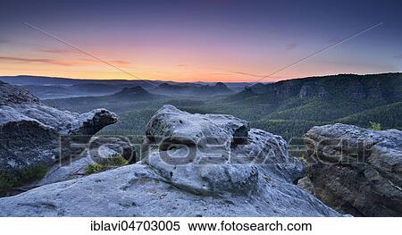 Dawn at Kleiner Winterberg, view of Lorenzsteine and Hinteres Raubschloss or Winterstein, Elbe Sandstone Mountains, Saxon Switzerland National Park, Saxony, Germany, Europe View Large Photo Image Stock Photography - Dawn at Kleiner Winterberg, view of Lorenzsteine and Hinteres Raubschloss or Winterstein, Elbe Sandstone Mountains, Saxon Switzerland National Park, Saxony, Germany, Europe. Fotosearch