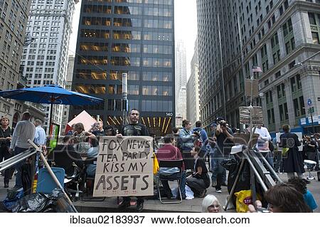 Democracy, protest, Occupy Wall Street movement, protestor holding a sign, lettering "Fox News Tea Party kiss my assets", Zuccotti Park, Financial District, Manhattan, New York City, USA, North America, America, North America View Large Photo Image Stock Photo - Democracy, protest, Occupy Wall Street movement, protestor holding a sign, lettering "Fox News Tea Party kiss my assets", Zuccotti Park, Financial District, Manhattan, New York City, USA, North America, America, North America. Fotosearch