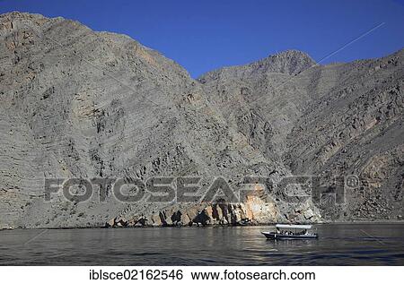 Dhow in the Bays of Musandam, Shimm Strait, in the Omani enclave of Musandam, Oman, Arabian Peninsula, Middle East, Asia View Large Photo Image Stock Photograph - Dhow in the Bays of Musandam, Shimm Strait, in the Omani enclave of Musandam, Oman, Arabian Peninsula, Middle East, Asia. Fotosearch