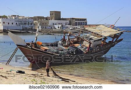 Dhow in the fishing port of Mirbat in the south of Oman, Arabian Peninsula, Middle East, Asia View Large Photo Image Stock Photograph - Dhow in the fishing port of Mirbat in the south of Oman, Arabian Peninsula, Middle East, Asia. Fotosearch
