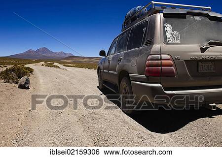 Dirt road with a jeep, Uyuni, Bolivia, South America View Large Photo Image Stock Photograph - Dirt road with a jeep, Uyuni, Bolivia, South America. Fotosearch
