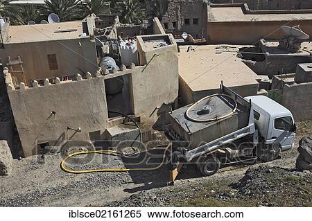 Drinking water delivery by truck in Bahla, Oman, Arabian Peninsula, Middle East, Asia View Large Photo Image Stock Photography - Drinking water delivery by truck in Bahla, Oman, Arabian Peninsula, Middle East, Asia. Fotosearch