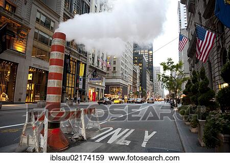 Dusk, temporary chimney, steam in the street, yellow cabs, taxis, 5th Avenue, Midtown, Manhattan, New York City, USA, North America, America, North America View Large Photo Image Stock Photo - Dusk, temporary chimney, steam in the street, yellow cabs, taxis, 5th Avenue, Midtown, Manhattan, New York City, USA, North America, America, North America. Fotosearch