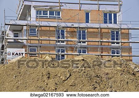 Earth bank in front of a scaffolded building under construction, apartment house, Ulm, Baden-Wuerttemberg, Germany, Europe, PublicGround, Europe View Large Photo Image Stock Image - Earth bank in front of a scaffolded building under construction, apartment house, Ulm, Baden-Wuerttemberg, Germany, Europe, PublicGround, Europe. Fotosearch