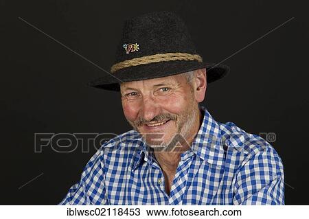 Elderly man wearing a traditional hat, portrait View Large Photo Image Stock Image - Elderly man wearing a traditional hat, portrait. Fotosearch