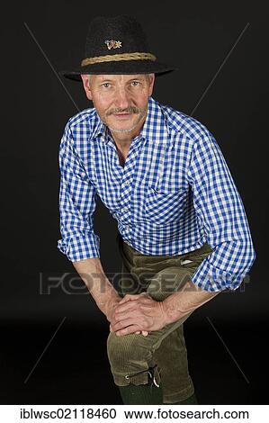Elderly man wearing a traditional hat and knickerbockers View Large Photo Image Stock Image - Elderly man wearing a traditional hat and knickerbockers. Fotosearch