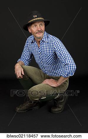 Stock Photo - Elderly man wearing a traditional hat and knickerbockers. Fotosearch