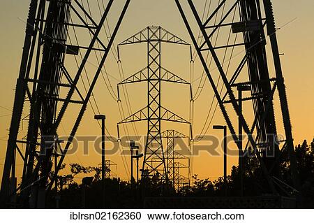 Stock Image - Electricity pylons at sunset, dusk, American Canyon, California, USA, North America. Fotosearch