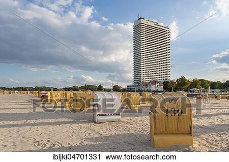 Stock Image - Empty beach with beach chairs, behind Hotel Maritim, Travemünde, Baltic Sea, Schleswig-Holstein, Germany, Europe. Fotosearch