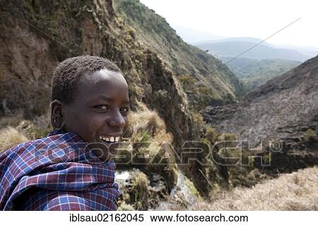 Ethnology, portrait, smiling Maasai boy, gorge at the Olmoti Crater, near Nainokanoka, Ngorongoro Conservation Area, Tanzania, East Africa, Africa View Large Photo Image Stock Photography - Ethnology, portrait, smiling Maasai boy, gorge at the Olmoti Crater, near Nainokanoka, Ngorongoro Conservation Area, Tanzania, East Africa, Africa. Fotosearch