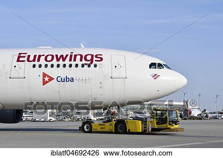 Eurowings, Airbus, A330 with Push Back Truck, Munich Airport, Upper Bavaria, Bavaria, Germany, Europe View Large Photo Image Stock Photograph - Eurowings, Airbus, A330 with Push Back Truck, Munich Airport, Upper Bavaria, Bavaria, Germany, Europe. Fotosearch