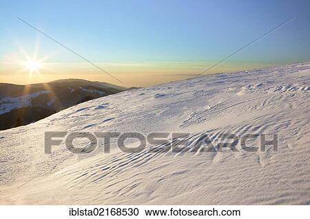 Stock Image - Evening mood in winter on Mt Belchen in the Black Forest, Baden-Wuerttemberg, Germany, Europe. Fotosearch