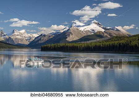 Excursion boat with tourists on Maligne Lake, behind it Queen Elizabeth Ranges, Jasper National Park, Rocky Mountains, Alberta, Canada, North America View Large Photo Image Stock Photography - Excursion boat with tourists on Maligne Lake, behind it Queen Elizabeth Ranges, Jasper National Park, Rocky Mountains, Alberta, Canada, North America. Fotosearch