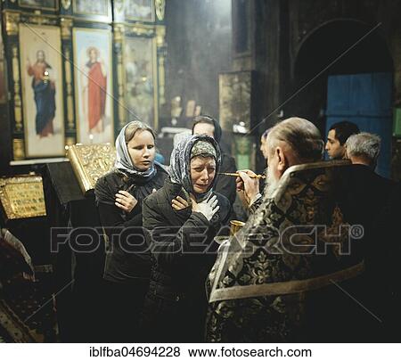 Exorcism during an Orthodox Mass in the Church, well-known Eorcist Father Sergei receives people from Russia who think they are possessed by the devil, Okhamchira, Abkhazia, Georgia, Asia View Large Photo Image Stock Photo - Exorcism during an Orthodox Mass in the Church, well-known Eorcist Father Sergei receives people from Russia who think they are possessed by the devil, Okhamchira, Abkhazia, Georgia, Asia. Fotosearch