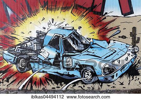Stock Image - Exploding car, car bomb, crash, comic-style graffiti, street art, Düsseldorf, North Rhine-Westphalia, Germany, Europe. Fotosearch