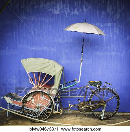 Fahradrickscha, rickshaw in front of a blue wall, Cheong Fatt Tze Mansion, blue villa, Leith Street in George Town, Penang, Malaysia, Asia View Large Photo Image Stock Image - Fahradrickscha, rickshaw in front of a blue wall, Cheong Fatt Tze Mansion, blue villa, Leith Street in George Town, Penang, Malaysia, Asia. Fotosearch