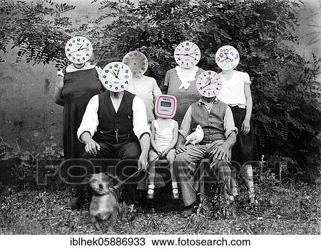 Stock Image - Family with watches as heads, assembly, about 1930, Germany, Europe. Fotosearch