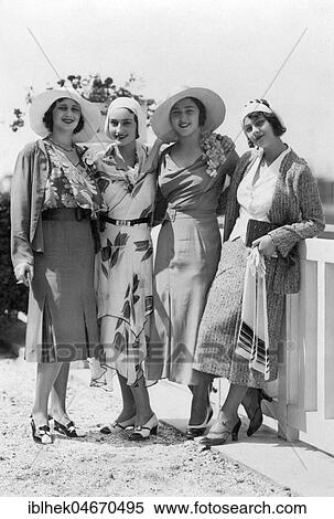 Stock Photography - Fashion, four women posing with hats and dress, 1920s, Baltic Sea, Germany, Europe. Fotosearch