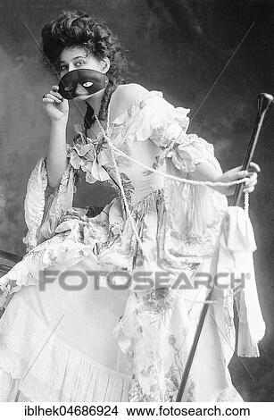 Fashion, seductive woman with a mask, 1910s, Germany, Europe View Large Photo Image Picture - Fashion, seductive woman with a mask, 1910s, Germany, Europe. Fotosearch