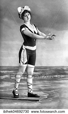 Stock Image - Fashion, swimwear, woman in beachwear, scenery photo, 1910s, Germany, Europe. Fotosearch