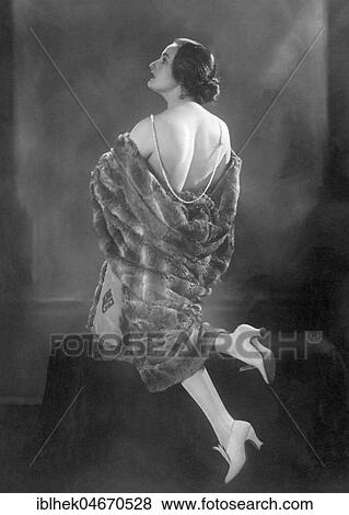 Fashion, woman with fur coat with free back and pearl necklace, 1920s, Germany, Europe View Large Photo Image Stock Photo - Fashion, woman with fur coat with free back and pearl necklace, 1920s, Germany, Europe. Fotosearch