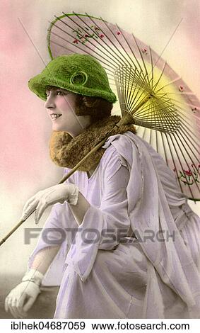 Stock Photo - Fashion, woman with gloves, hat, summer dress and parasol, 1910s, Germany, Europe. Fotosearch
