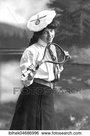 Stock Photograph - Fashion, woman with tennis rackets and sportswear, 1910s, Germany, Europe. Fotosearch