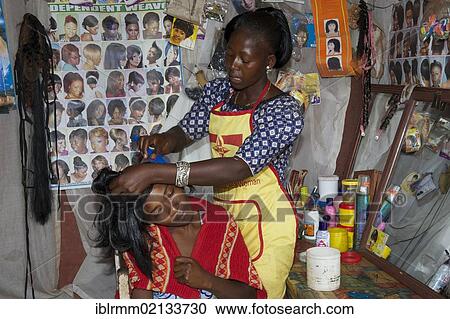 Female hairdresser and customer, hairdresser's shop, Bamenda, Cameroon, Africa View Large Photo Image Stock Image - Female hairdresser and customer, hairdresser's shop, Bamenda, Cameroon, Africa. Fotosearch