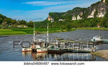 Ferry on the Elbe at the pier, Rathen, Elbe Sandstone Mountains, Saxony, Germany, Europe View Large Photo Image Stock Photo - Ferry on the Elbe at the pier, Rathen, Elbe Sandstone Mountains, Saxony, Germany, Europe. Fotosearch