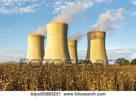Stock Image - Field and cooling towers of Dukovany Nuclear Power Station, Czech Republic, Europe. Fotosearch