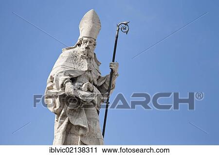 Stock Image - Figure of an apostle on the facade of the Basilica San Giovanni in Laterano, Rome, Italy, Europe. Fotosearch