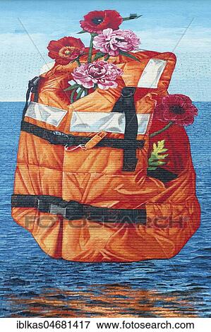 Flowered lifejacket, floats above the sea, mural on immigration, by US streetart artist Gaia, Ostend, West Flanders, Belgium, Europe View Large Photo Image Stock Photo - Flowered lifejacket, floats above the sea, mural on immigration, by US streetart artist Gaia, Ostend, West Flanders, Belgium, Europe. Fotosearch