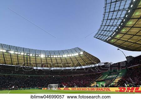 Football stadium illuminated with perimeter advertising, blue hour, DFB Cup Final 2018, Olympic Stadium Berlin, Germany, Europe View Large Photo Image Stock Photo - Football stadium illuminated with perimeter advertising, blue hour, DFB Cup Final 2018, Olympic Stadium Berlin, Germany, Europe. Fotosearch