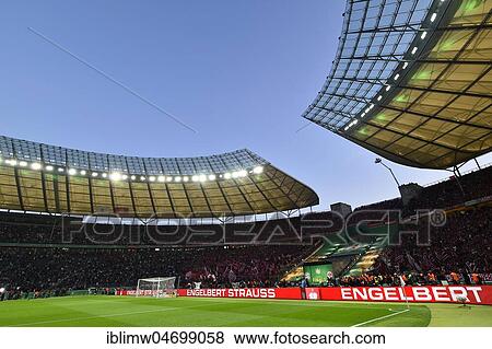 Football stadium illuminated with perimeter advertising, blue hour, DFB Cup Final 2018, Olympic Stadium Berlin, Germany, Europe View Large Photo Image Stock Photo - Football stadium illuminated with perimeter advertising, blue hour, DFB Cup Final 2018, Olympic Stadium Berlin, Germany, Europe. Fotosearch