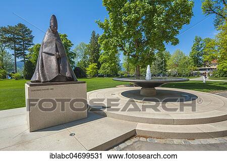 Fountain and bronze sculpture, the Cardinal of Giacomo Manzù, park at Tegernsee Abbey, Tegernsee, Upper Bavaria, Bavaria, Germany, Europe View Large Photo Image Stock Image - Fountain and bronze sculpture, the Cardinal of Giacomo Manzù, park at Tegernsee Abbey, Tegernsee, Upper Bavaria, Bavaria, Germany, Europe. Fotosearch