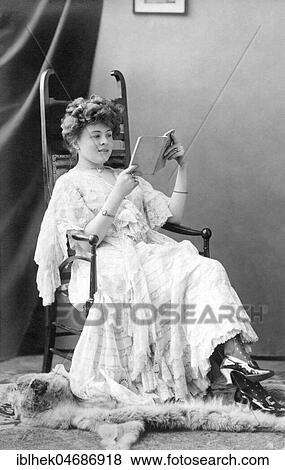 Stock Photo - Frau read a book, 1900s, Germany, Europe. Fotosearch