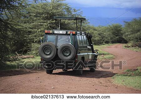 Game drive in Serengeti National Park, Tanzania, Africa View Large Photo Image Stock Image - Game drive in Serengeti National Park, Tanzania, Africa. Fotosearch