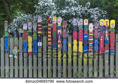 Garden fence decorated with painted wooden figures, Bavaria, Germany, Europe View Large Photo Image Stock Image - Garden fence decorated with painted wooden figures, Bavaria, Germany, Europe. Fotosearch