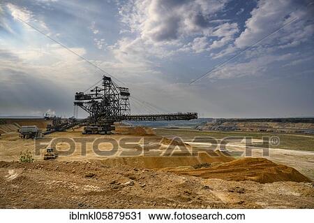 Stock Image - Garzweiler opencast lignite mine, spreader, belt conveyor. Jüchen, Rhenish Lignite Mining Area, North Rhine-Westphalia, Germany, Europe. Fotosearch