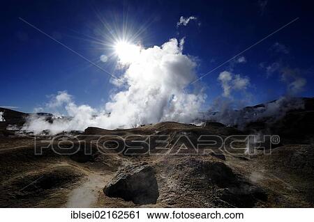 Geysers with water vapour against a deep blue sky and the star-shaped sun, Uyuni, Bolivia, South America View Large Photo Image Stock Image - Geysers with water vapour against a deep blue sky and the star-shaped sun, Uyuni, Bolivia, South America. Fotosearch