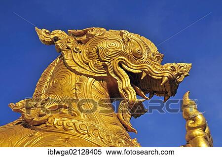 Stock Photography - Gilded lion, Singha, a guardian figure at the entrance of Wat Pho Chai temple, Nong Khai, Thailand, Asia, PublicGround, Asia. Fotosearch