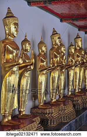 Gilded standing Buddha statues, Abhahya-mudra, a pose depicting Buddha's protection and peace, a gesture of fearlessness, or the granting of protection, Wat Pho, Bangkok, Thailand, Asia, PublicGround, Asia View Large Photo Image Stock Image - Gilded standing Buddha statues, Abhahya-mudra, a pose depicting Buddha's protection and peace, a gesture of fearlessness, or the granting of protection, Wat Pho, Bangkok, Thailand, Asia, PublicGround, Asia. Fotosearch