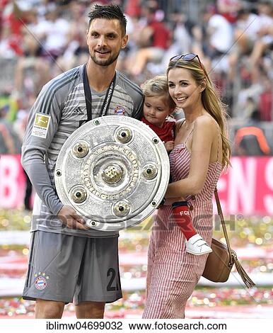 Goalkeeper Sven Ulreich FC Bayern Munich with his wife Lisa, daughter Malia und championship cup, Allianz Arena, Munich, Bavaria, Germany, Europe View Large Photo Image Stock Image - Goalkeeper Sven Ulreich FC Bayern Munich with his wife Lisa, daughter Malia und championship cup, Allianz Arena, Munich, Bavaria, Germany, Europe. Fotosearch