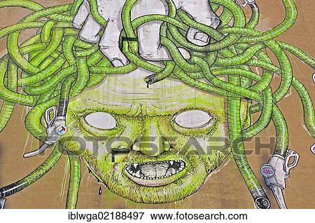 Stock Photo - Graffiti, Medusa with fuel hoses, a protest against the oil industry, Cityleaks Festival, Cologne, North Rhine-Westphalia, Germany, Europe, PublicGround, Europe. Fotosearch