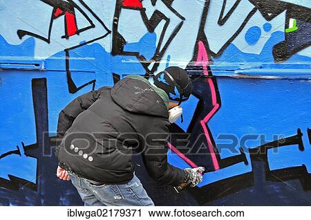 Stock Image - Graffiti sprayer or artist, 11 years, Cologne, North Rhine-Westphalia, Germany, Europe, PublicGround, Europe. Fotosearch