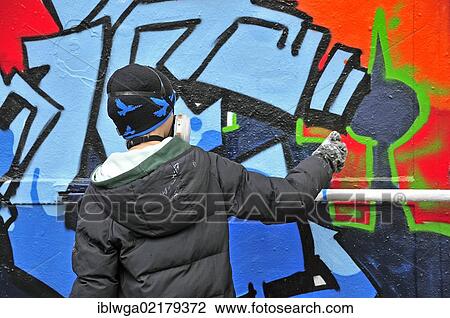 Stock Image - Graffiti sprayer or artist, 11 years, Cologne, North Rhine-Westphalia, Germany, Europe, PublicGround, Europe. Fotosearch