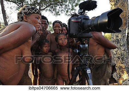 Group of San people, from the Bushman tribe, curious behind the camera, Ju/'Hoansi-San near Tsumkwe, Otjozondjupa region, Namibia, Africa View Large Photo Image Stock Photography - Group of San people, from the Bushman tribe, curious behind the camera, Ju/'Hoansi-San near Tsumkwe, Otjozondjupa region, Namibia, Africa. Fotosearch